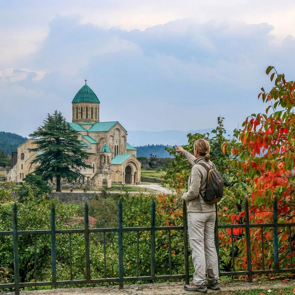 woman pointing at Bagrati Cathedral in Kutaisi, Georgia
