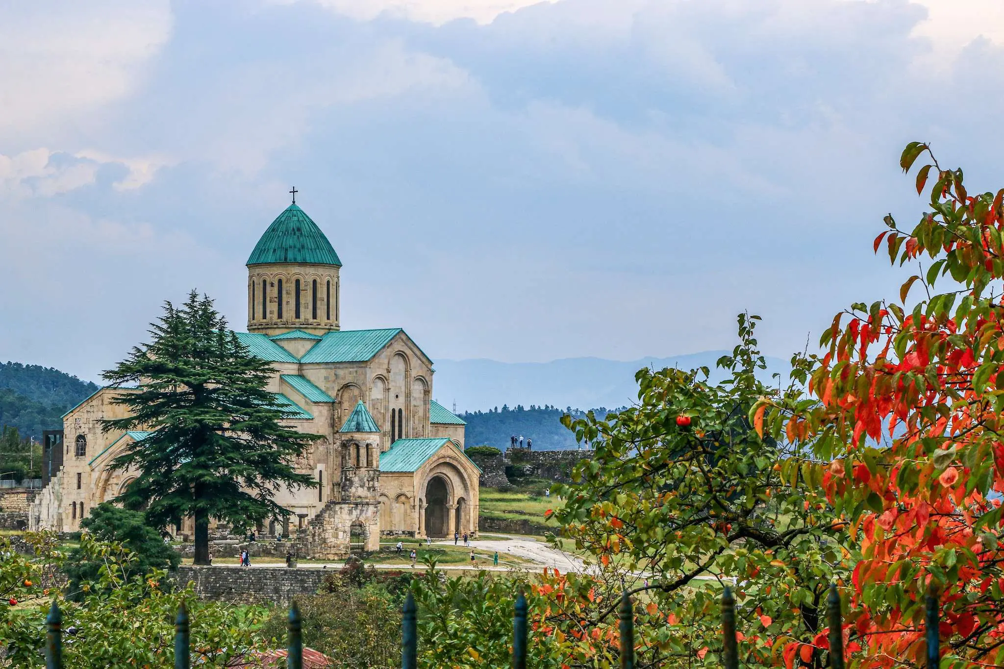 Bagrati Cathedral in Kutaisi, Georgia with autumn foliage