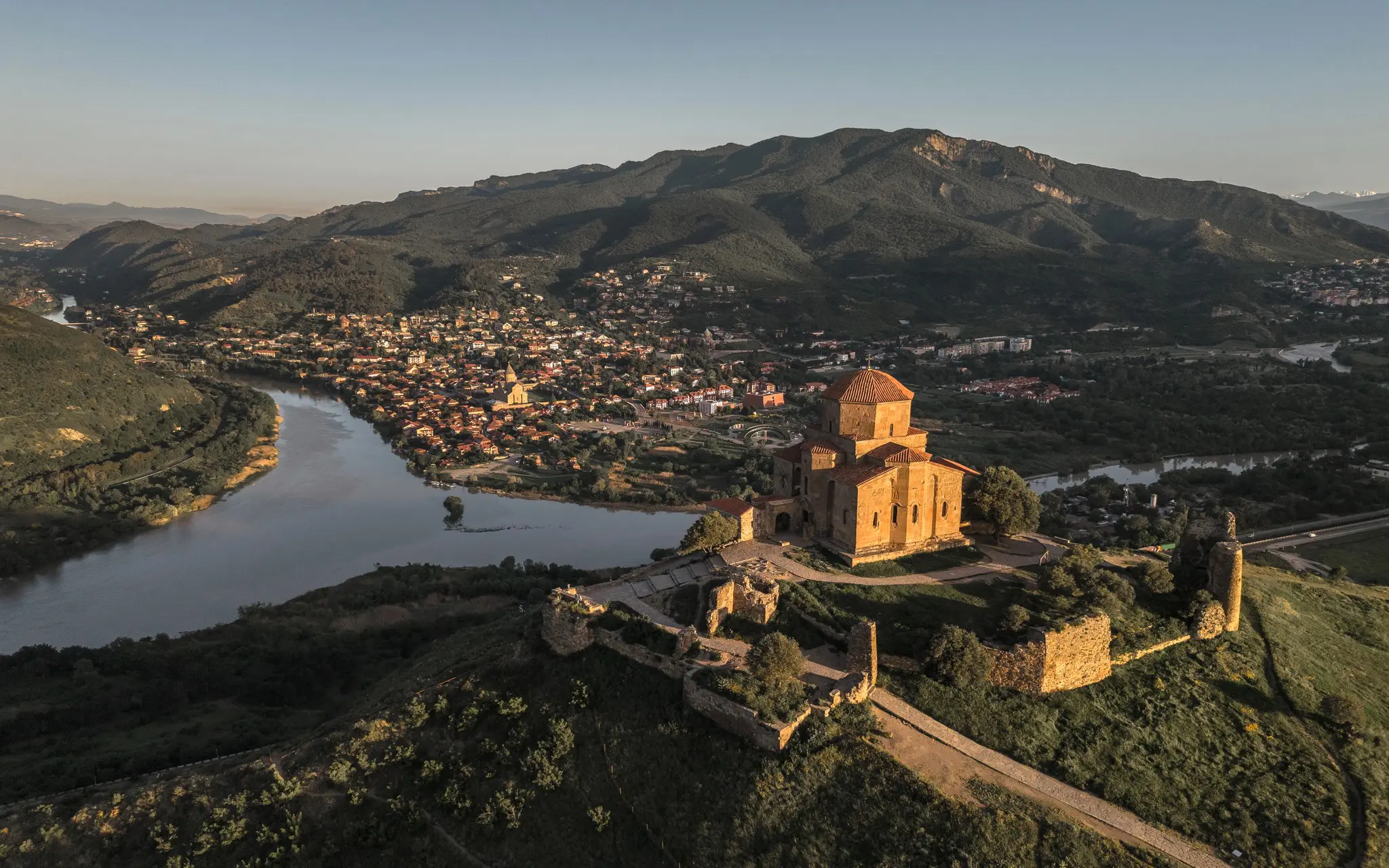 aerial view of Jvari Monastery and Mtskheta, Georgia at sunset